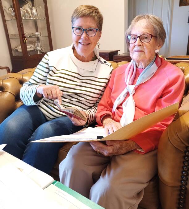 Josephine and Helen Raw with a copy of Prime Minister Billy Hughes' 1919 peace conference speech.