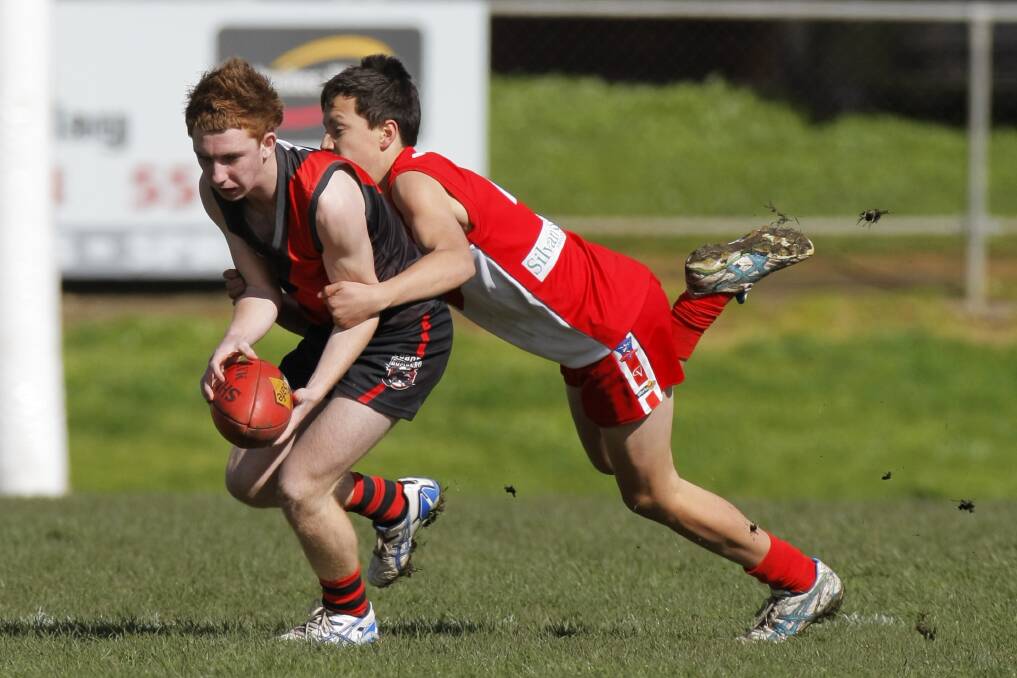 Hugh McCluggage wraps up a Cobden opponent during an under 16 game in 2013. File picture