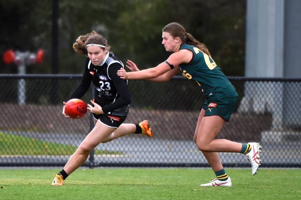 South Warrnambool's Maggie Johnstone evades a tackler while playing for the Rebels. Picture by Adam Trafford