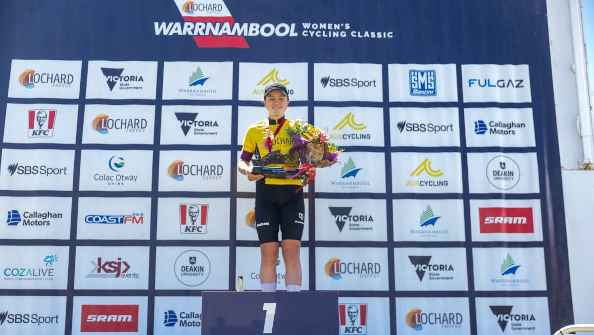Lucie Stewart stands on top of the podium after winning the 2024 Lochard Energy Warrnambool Women's Cycling Classic. Picture by Eddie Guerrero