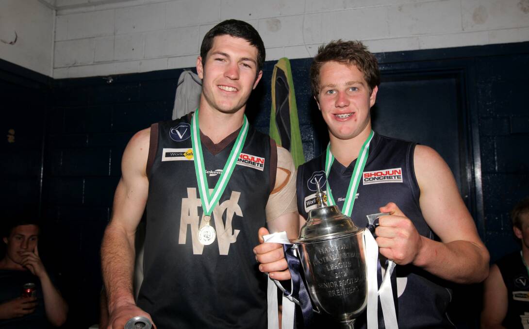 Blues teammates Liam Hoy 'senior' and Liam Hoy 'junior' hold the cup after their 2012 triumph. File picture