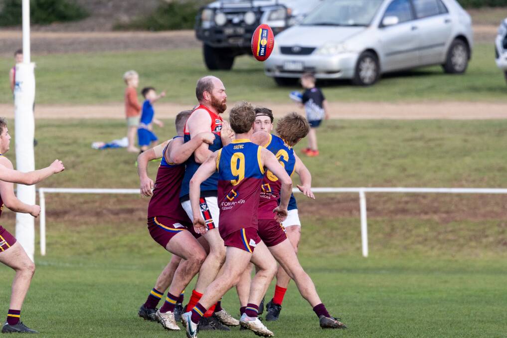 Timboon Demons playing-coach Marcus Hickey is surrounded by the South Rovers opposition. Picture by Anthony Brady