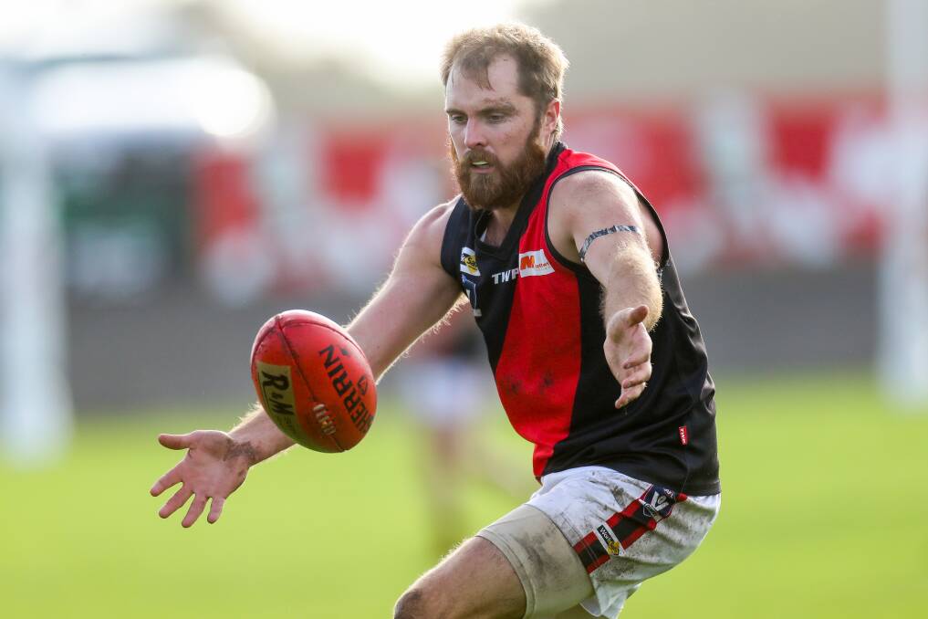 Louis Cahill, pictured in 2019 playing for Cobden, played 196 senior games for the Bombers. File picture
