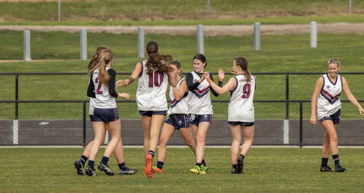 Olivia Wolter celebrates with teammates after kicking a goal. Picture supplied