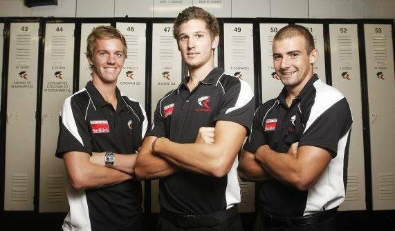 North Melbourne first-year players Brayden Norris, Aaron Black and Ben Cunnington in VFL feeder club North Ballarat Roosters' colours in 2010.