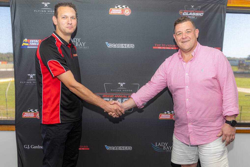 Premier Speedway general manager Michael Parry and Flying Horse Bar and Brewery co-owner Mark McIlroy shake hands after Flying Horse was announced as the Grand Annual Sprintcar Classic's naming rights sponsor. Picture by Eddie Guerrero