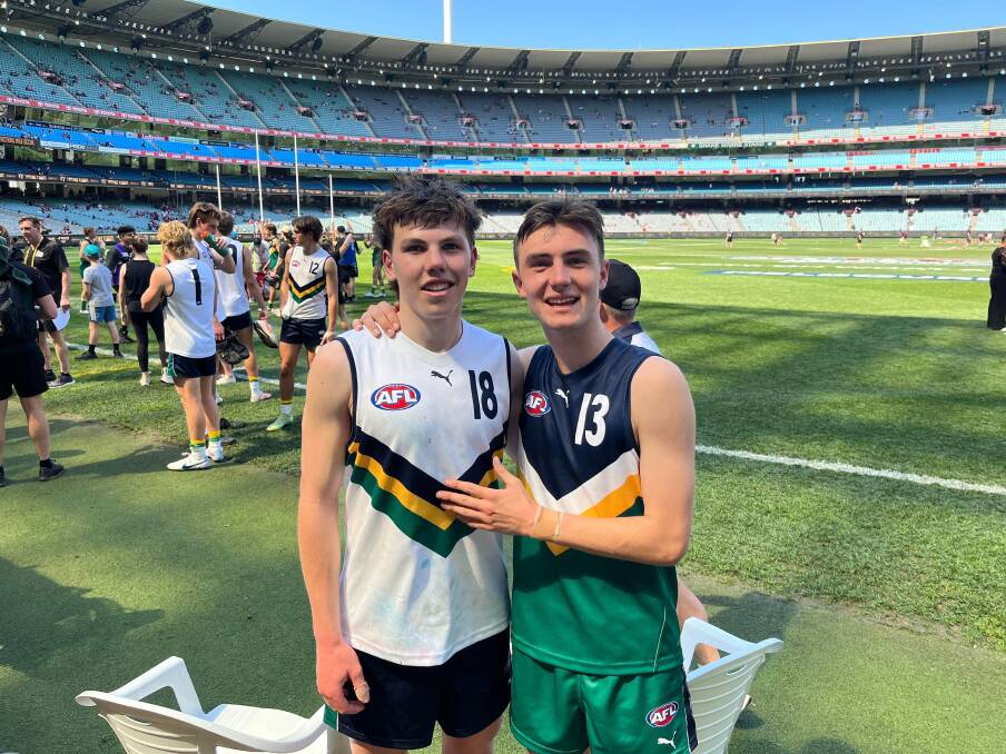 Koroit's Finn O'Sullivan (left), with Oakleigh Chargers teammate Jagga Smith, played in the under 17 futures match at the MCG before the AFL grand final. Picture supplied