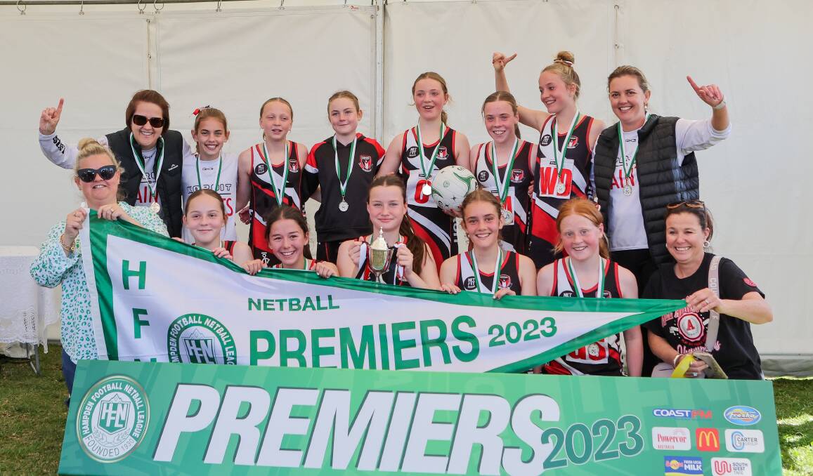 Koroit's 13 and under netball team pictured with the premiership flag. Picture by Anthony Brady