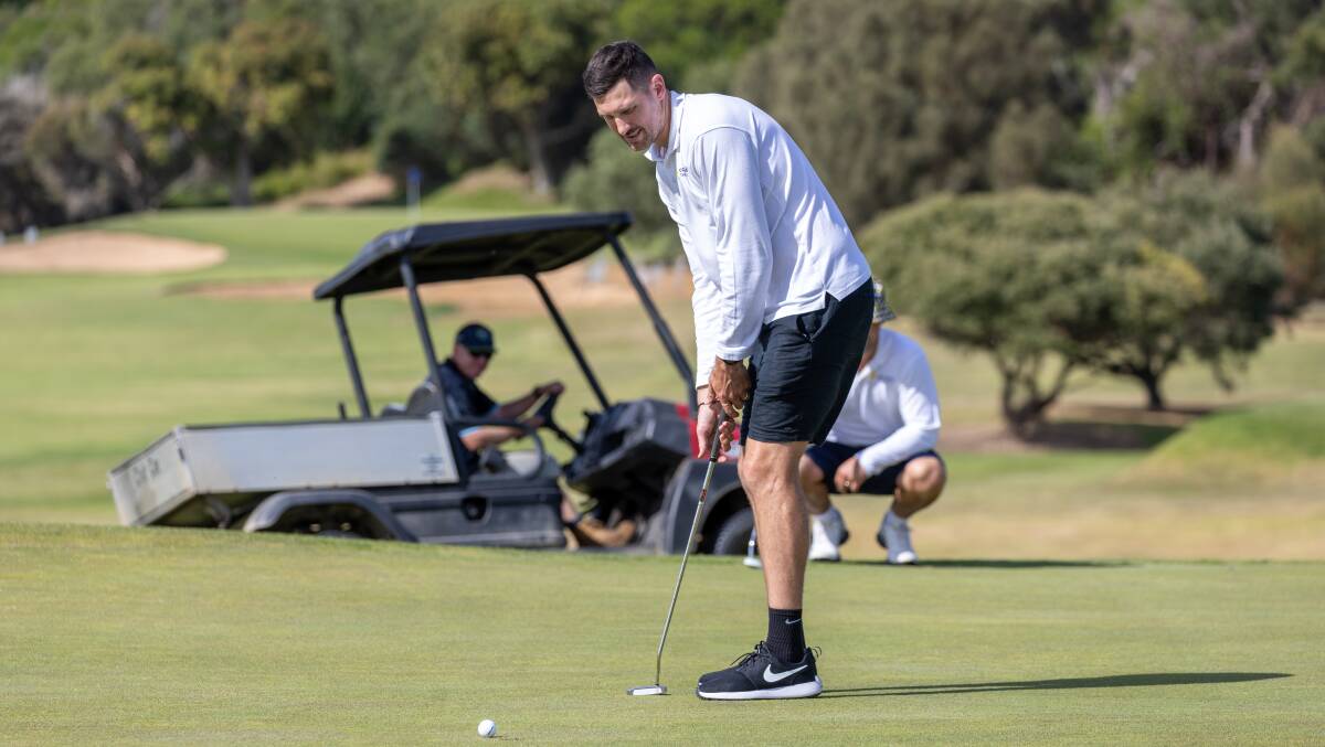 Aaron Black watches to see if his putt rolls in. Picture by Eddie Guerrero