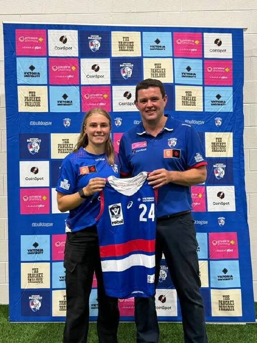 Western Bulldogs VFLW coach Rhys Cahir hands Renee Saulitis her playing jumper earlier in the year. Picture supplied