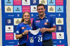 Western Bulldogs VFLW coach Rhys Cahir hands Renee Saulitis her playing jumper earlier in the year. Picture supplied