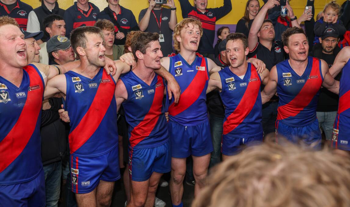 Terang Mortlake players belt out their team song after their win against Cobden. Picture by Eddie Guerrero