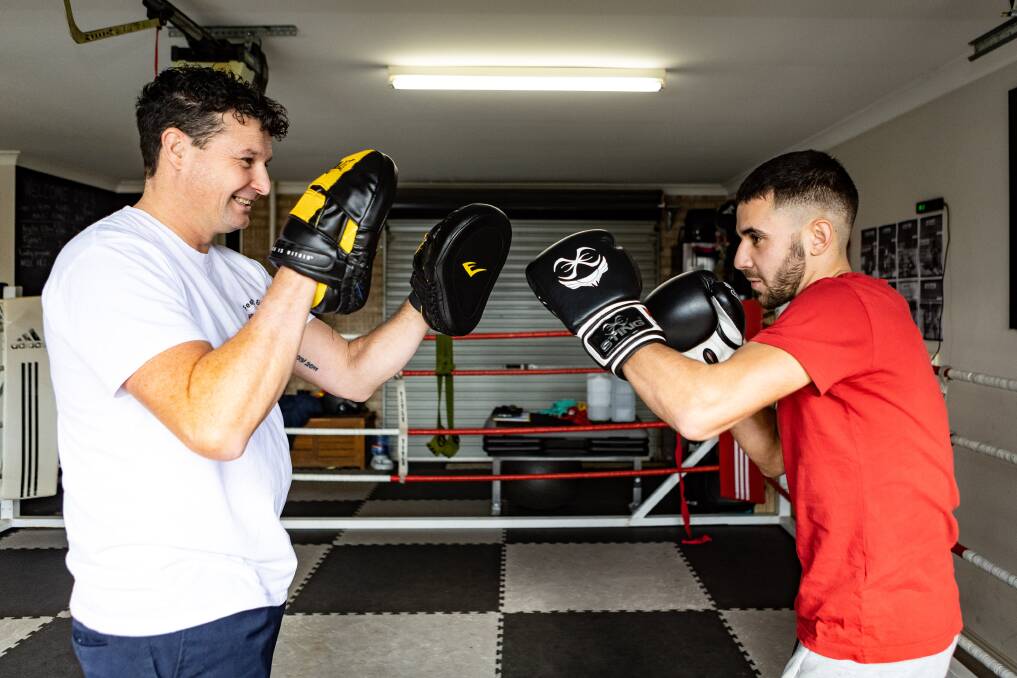 Prouzat Melvin (right) with coach Paul Hrabar ahead of Melvin's debut amateur bout on Sunday. Picture by Anthony Brady