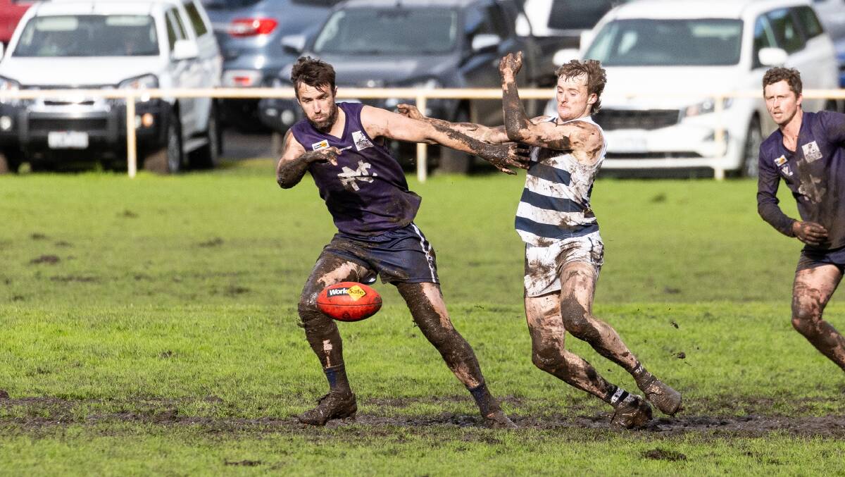 Nirranda's Ben Dobson competes for the ball with Allansford's Cooper Day. Picture by Anthony Brady