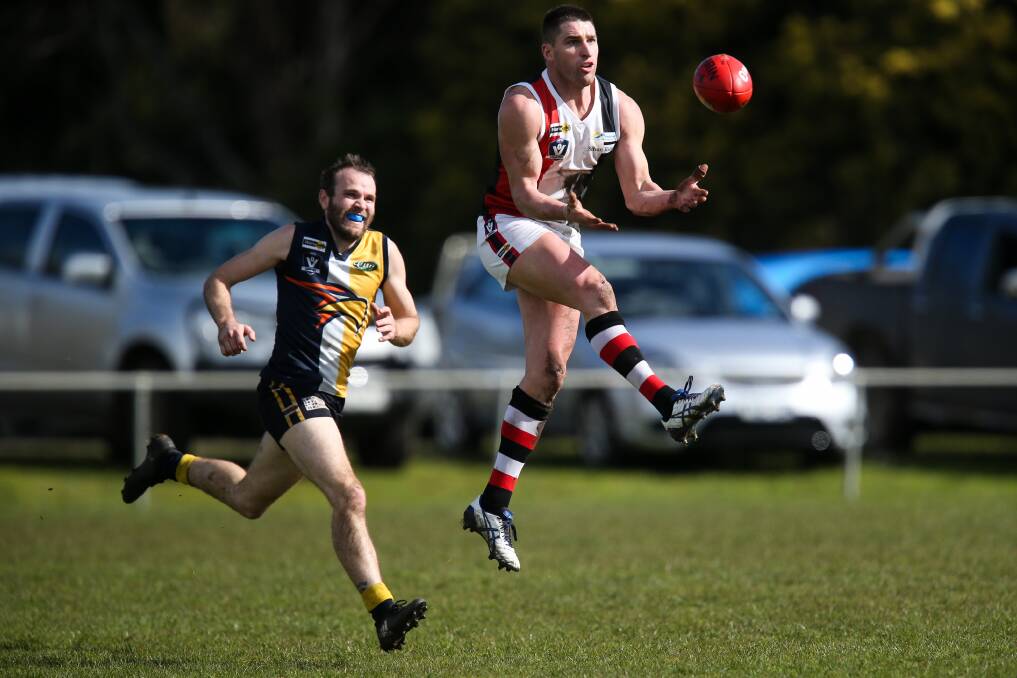 Tim McIntyre jumps for a mark while playing for Koroit in 2017. File picture