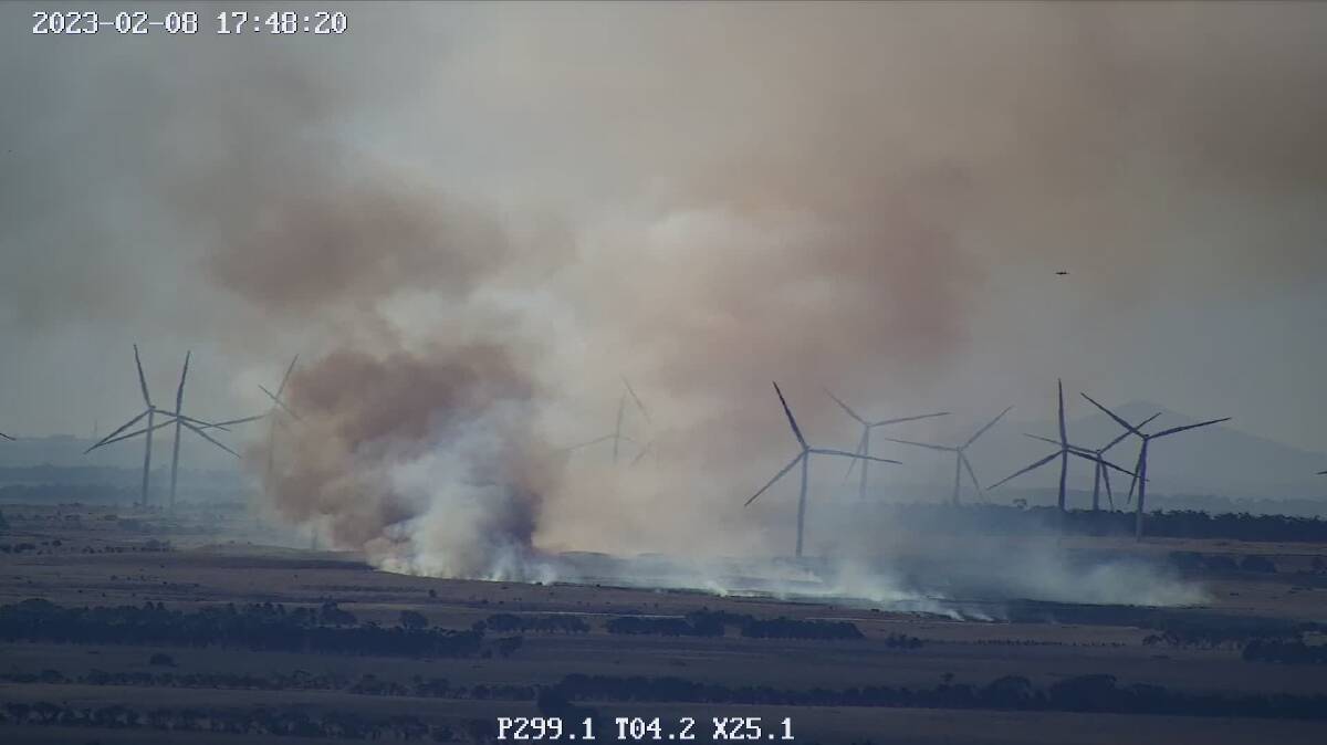 The fire continuing to move west towards the turbines due to a 20km/h easterly wind, while aircraft regularly bomb the area to bring the blaze under control.