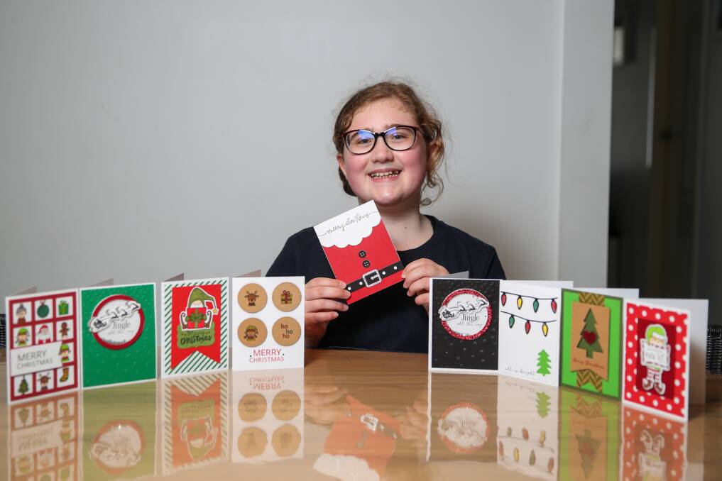 JOY FOR ALL: 12-year-old Charlize Materia has always enjoyed making Christmas cards, but this year she is selling some to raise funds for Emma House. Picture: Morgan Hancock