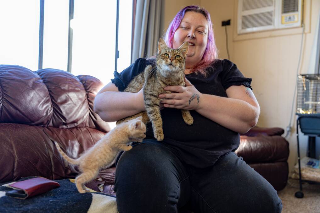 Purnim resident Mishay Chambers and Lucky the family cat who was picked up by the ranger five years after he went missing. Picture by Eddie Guerrero.