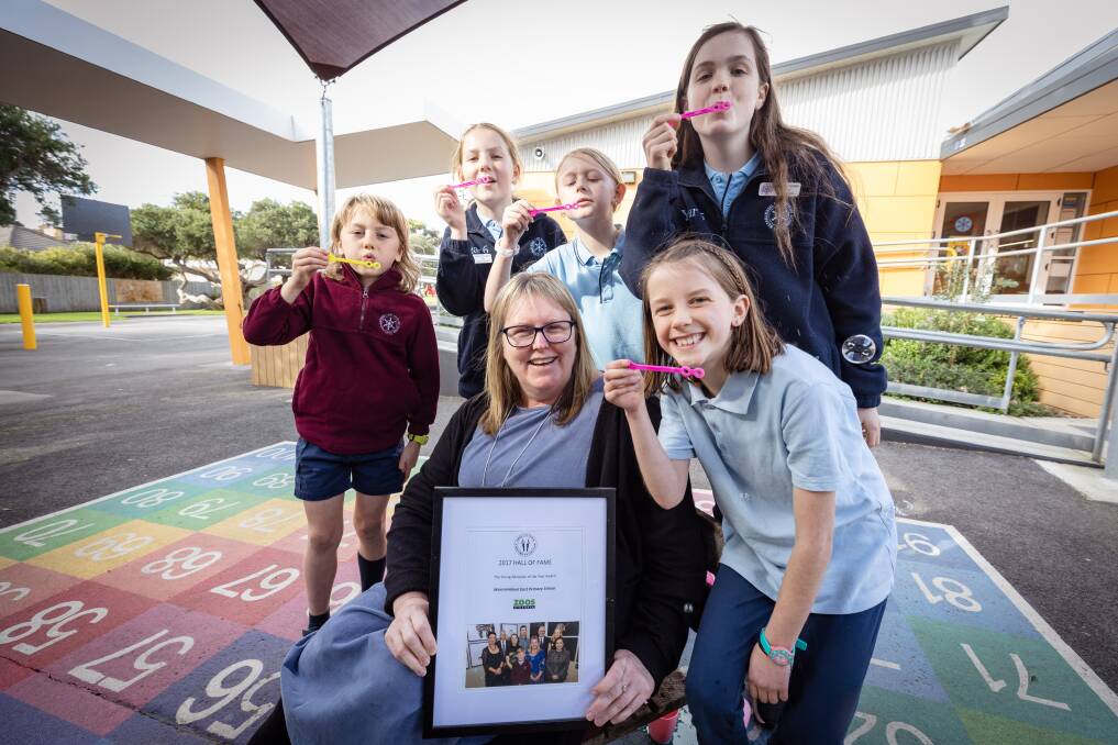 Warrnambool East Primary School kids have a new display at Melbourne Zoo focusing on their involvement in the Bubbles Not Balloons anti-pollution program. Teacher Kerry McCarthy is joined by Fred Goodall, 9, Lily Cheeseman, 12, Evie Hanson, 9, Lexie McKenzie, 12, and Madison Sandri, 9. Picture by Sean McKenna