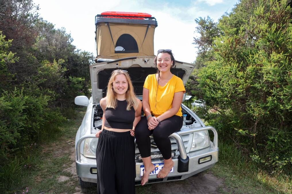 International backpackers Bethany Luscombe and Antonella D'Aloia became stranded near the Twelve Apostles after Ms D'Aloia's car broke down. Picture by Anthony Brady