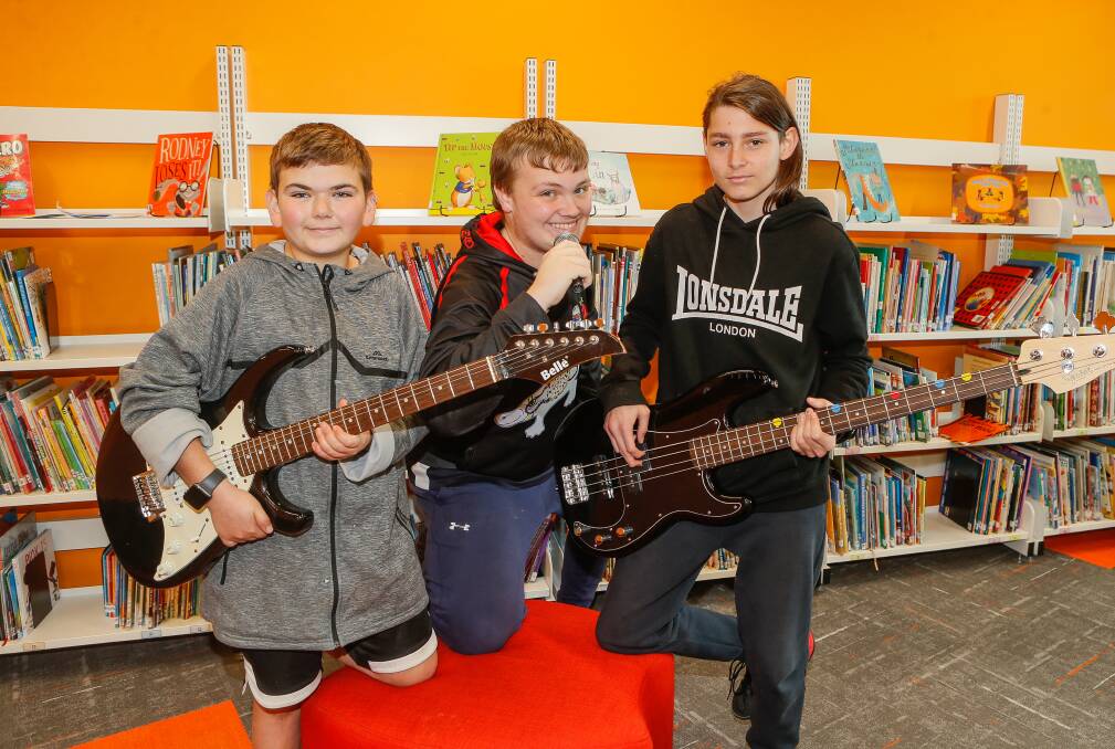 Merri River School band members Brohdi Hosking, Jacob Paton-Lee and Blade Mozes in the library where the students undertake music classes. Picture: Anthony Brady