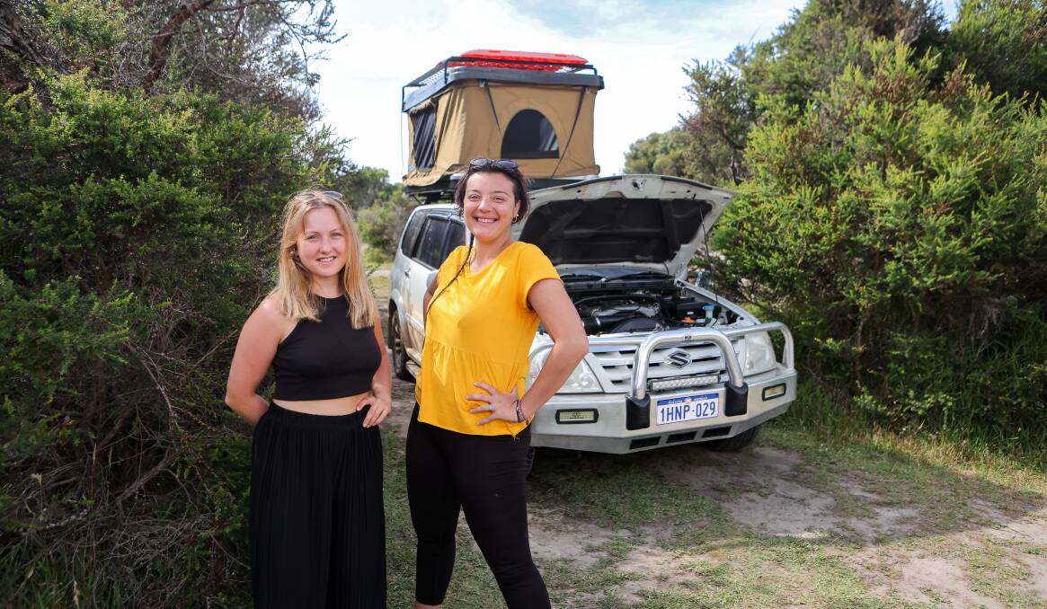 Backpackers Bethany Luscombe and Antonella D'Aloia became stranded near the Twelve Apostles after Ms D'Aloia's car broke down. Picture by Anthony Brady