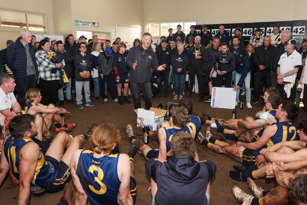 Coach Adam Dowie addresses the Eagles' players and supporters after the win on Saturday. Picture by Eddie Guerrero