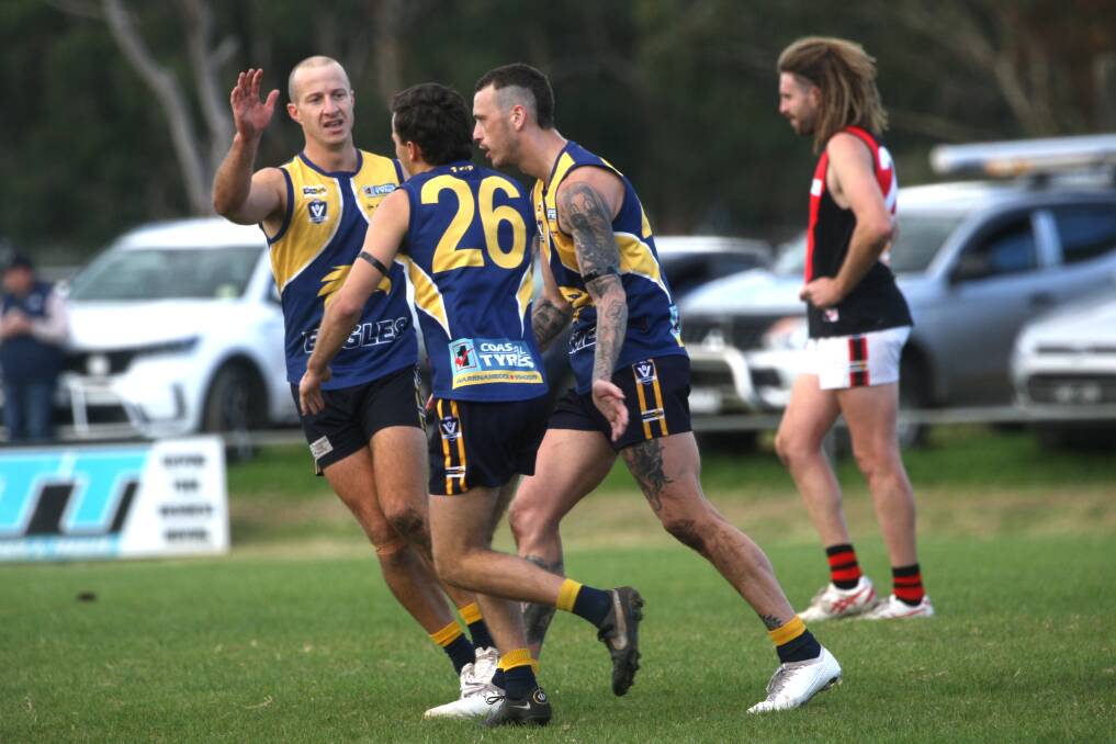 Matt Wines, Luke Kenna and Angus Noske celebrate a North Warrnambool Eagles goal in round four. Picture by Meg Saultry