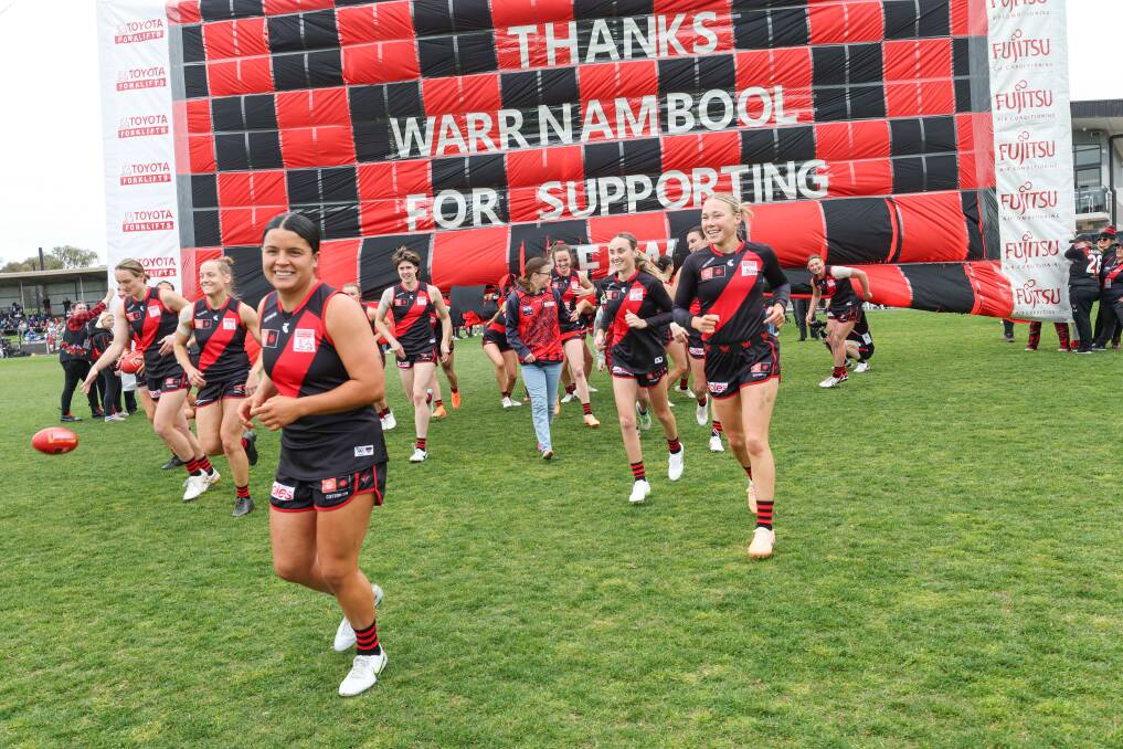 Maddy Prespakis leads Essendon out in her 50th AFLW game. Picture by Sean McKenna.