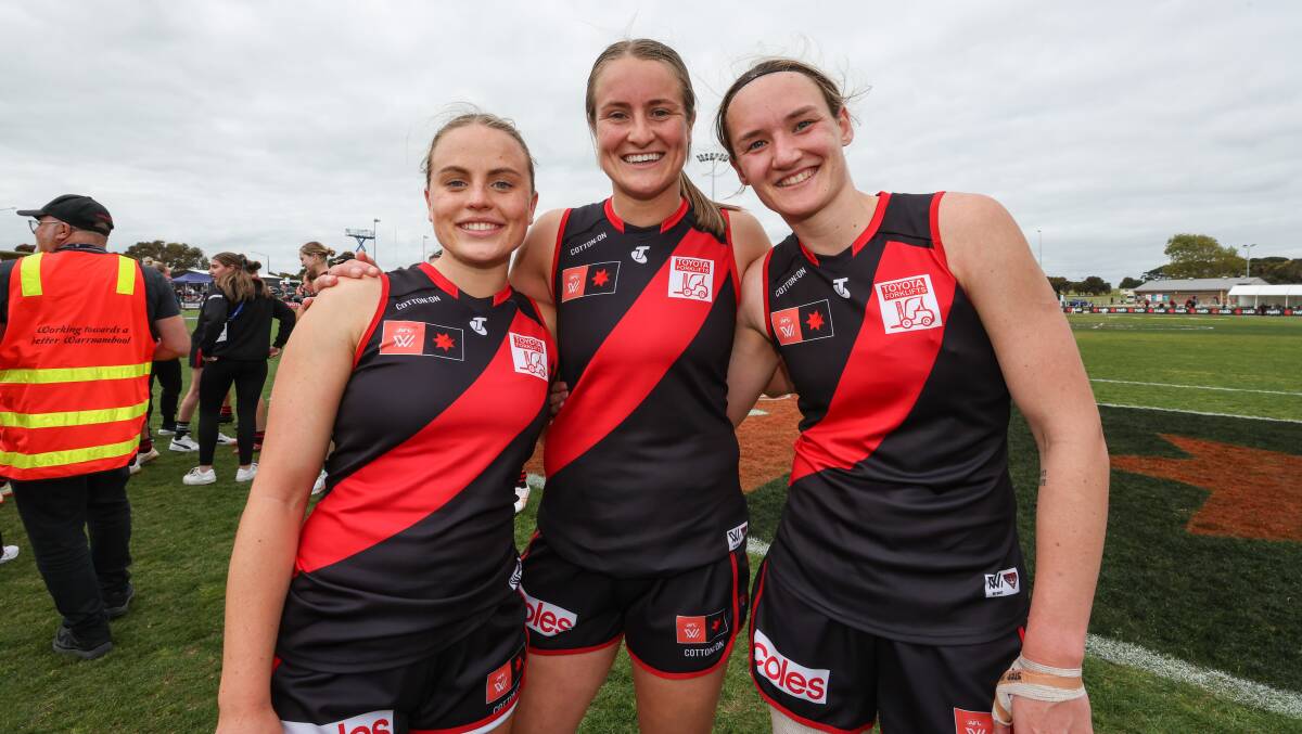 Georgia Clarke (right) with Essendon teammates Mia Busch and Ellyse Gamble after their win at Warrnambool on Sunday. Picture by Sean McKenna.
