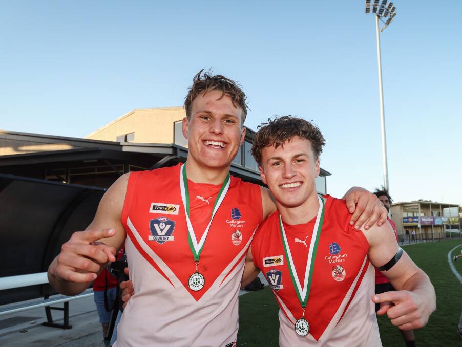 George and Archie Stevens celebrate becoming senior premiership players for South Warrnambool. Picture by Sean McKenna