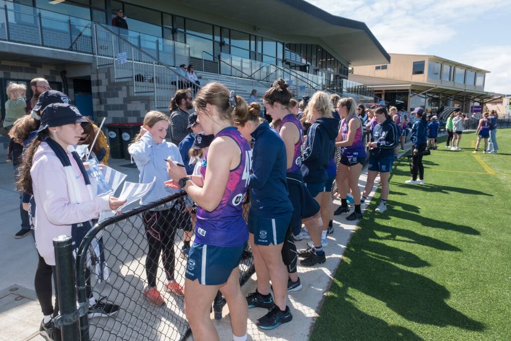 Geelong players sign autographs at an open trianing session in Warrnambool in 2022. Picture by Sean McKenna