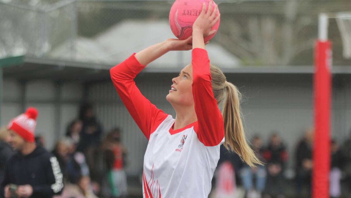South Warrnambool goal shooter Hollie Phillips puts shot up during warm up. Picture by Meg Saultry