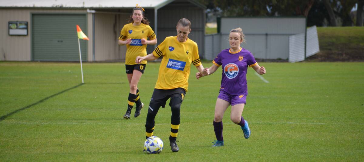 Warrnambool Wolves' Debbie Clowes dribbles up the pitch. Picture supplied