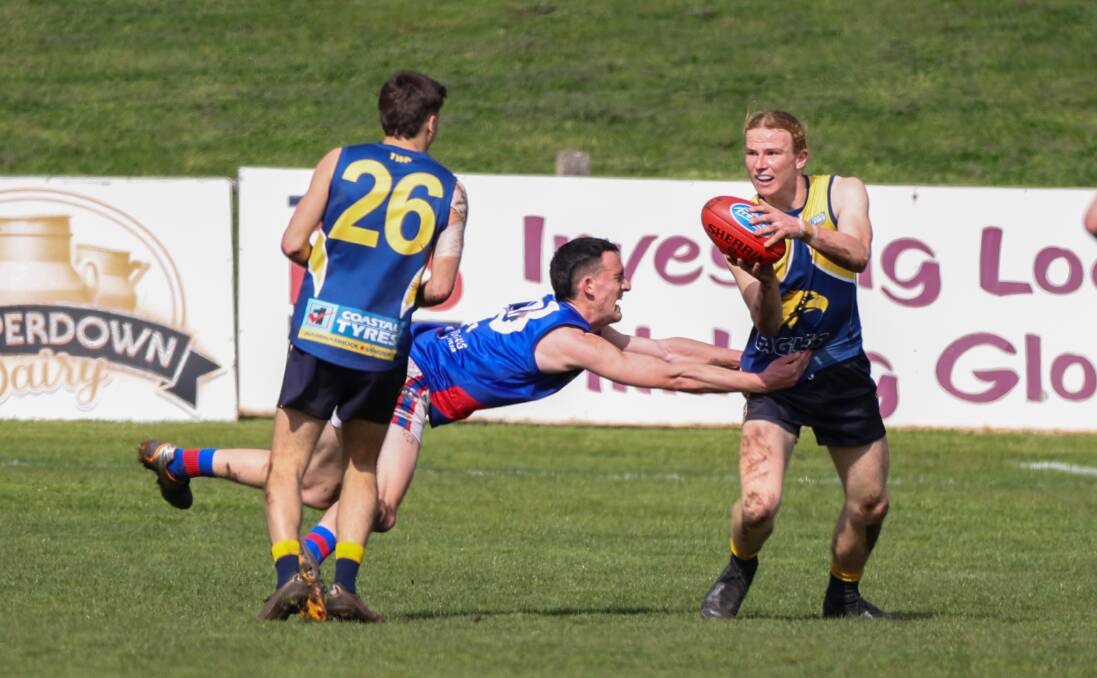 North Warrnambool Eagles' Charlie McKinnon (right) holds his ground under pressure from Terang Mortlake forward Will Kain. Picture by Eddie Guerrero