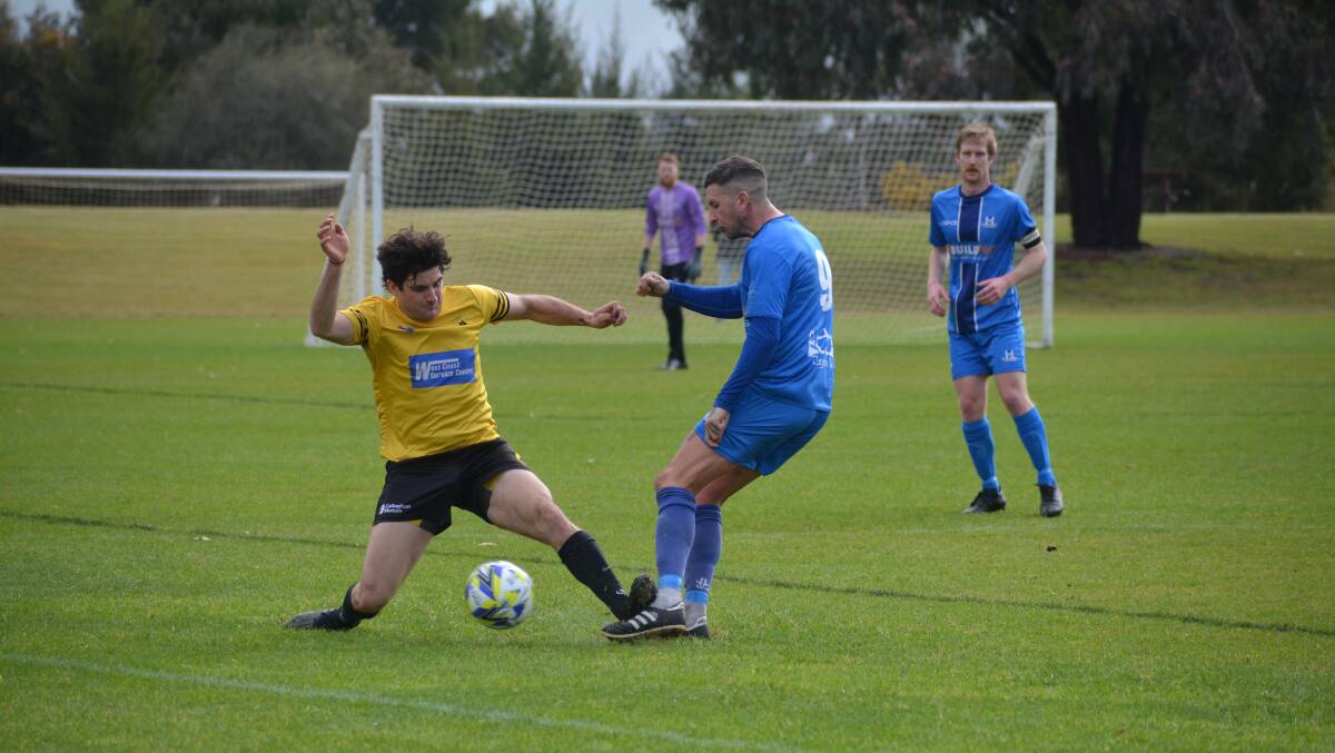 Warrnambool Wolves' Josh Bourke and Warrnambool Rangers' George Paspaliaris vie for possession. Picture supplied