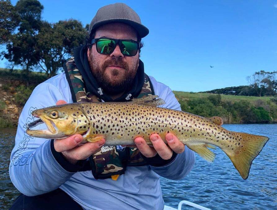 Luke Smith shows off his Hopkins River trout. Pictures supplied