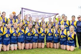 North Warrnambool under 15 girls team celebrates its grand final win on Sunday. Pictures by Anthony Brady