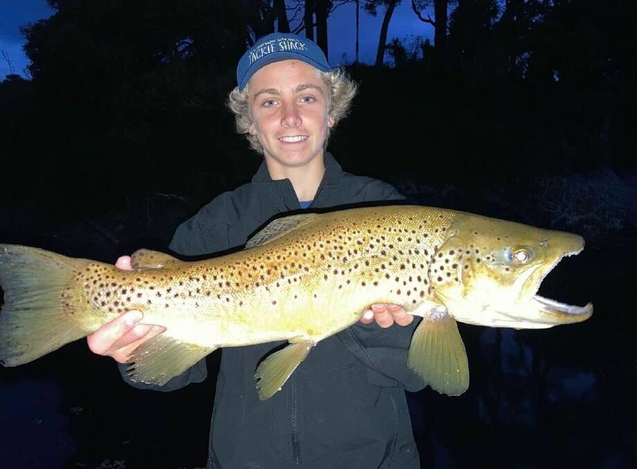 Ollie Sharp with his big brown trout caught recently. Pictures supplied