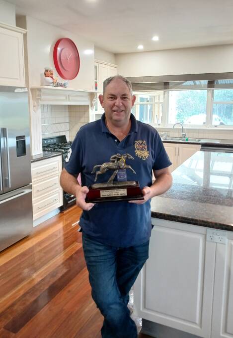 Yambuks Jim Forrest with the 2021 Lafferty Hurdle trophy won by Saunter Boy at Warrnambool. Picture supplied