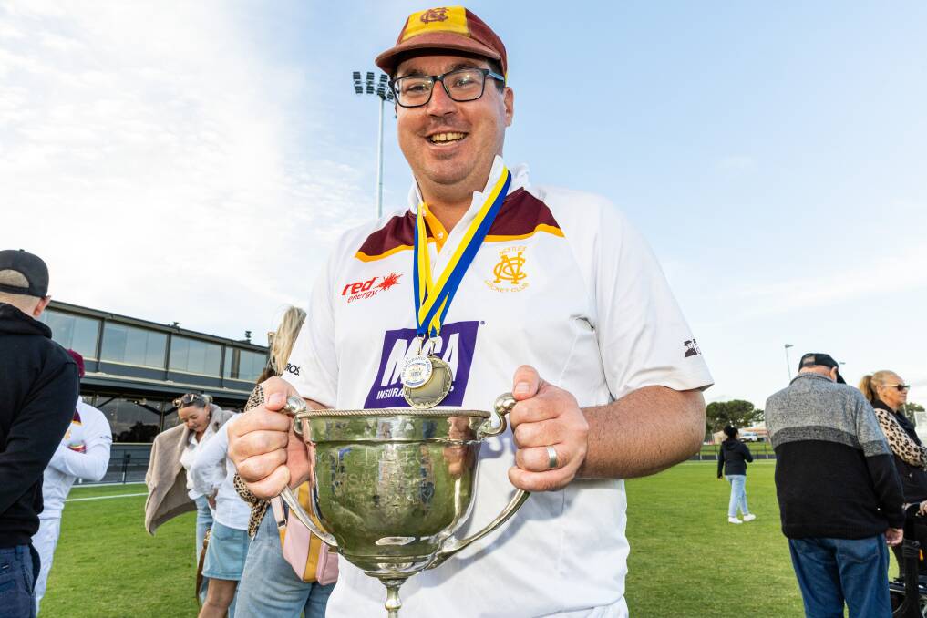 Geoff Williams soaks it all in with the WDCA premiership cup on Saturday afternoon. Picture by Sean McKenna