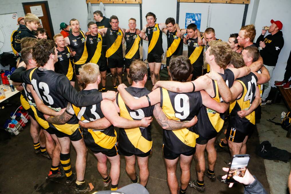 ONE STEP CLOSER: Merrivale sings the song in the rooms after the win against Russells Creek. Picture: Anthony Brady