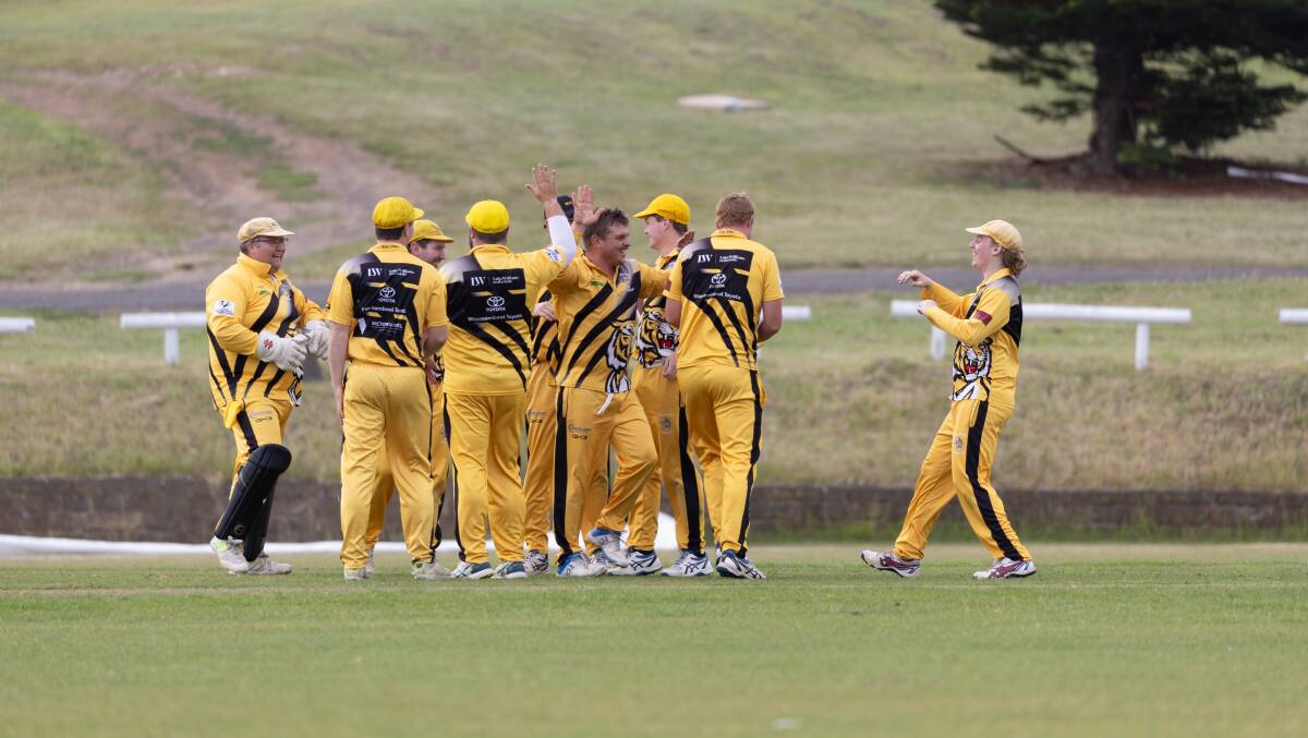 Merrivale's Joe Kenna (middle) celebrates one of his four wickets against Koroit with teammates. Pictures by Eddie Guerrero