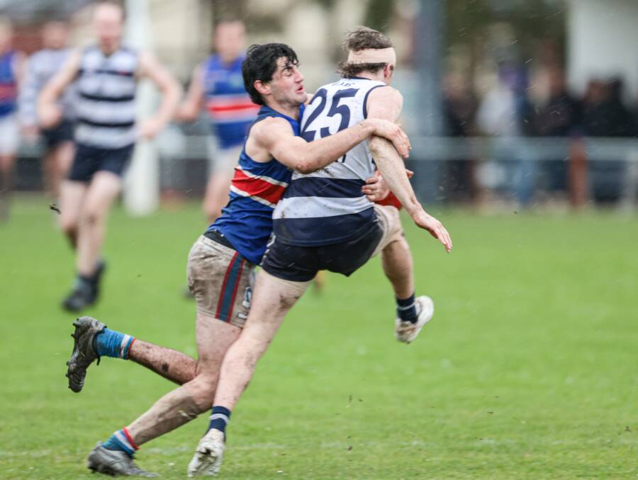 Panmure captain Jacob Moloney lays a big tackle on Allansford's Cooper Day. Picture by Sean McKenna