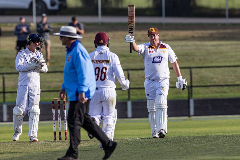 Nestles champion Geoff Williams raises the bat after his century in the WDCA division one grand final last season. Picture by Sean McKenna