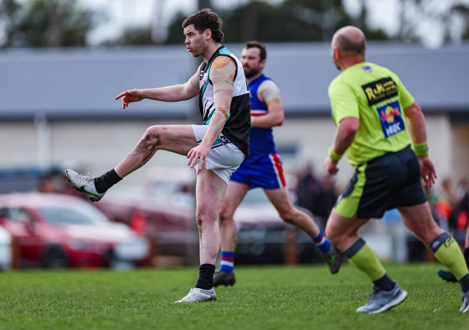 Bourke gets a kick away in the semi-final clash against Panmure. Picture by Sean McKenna