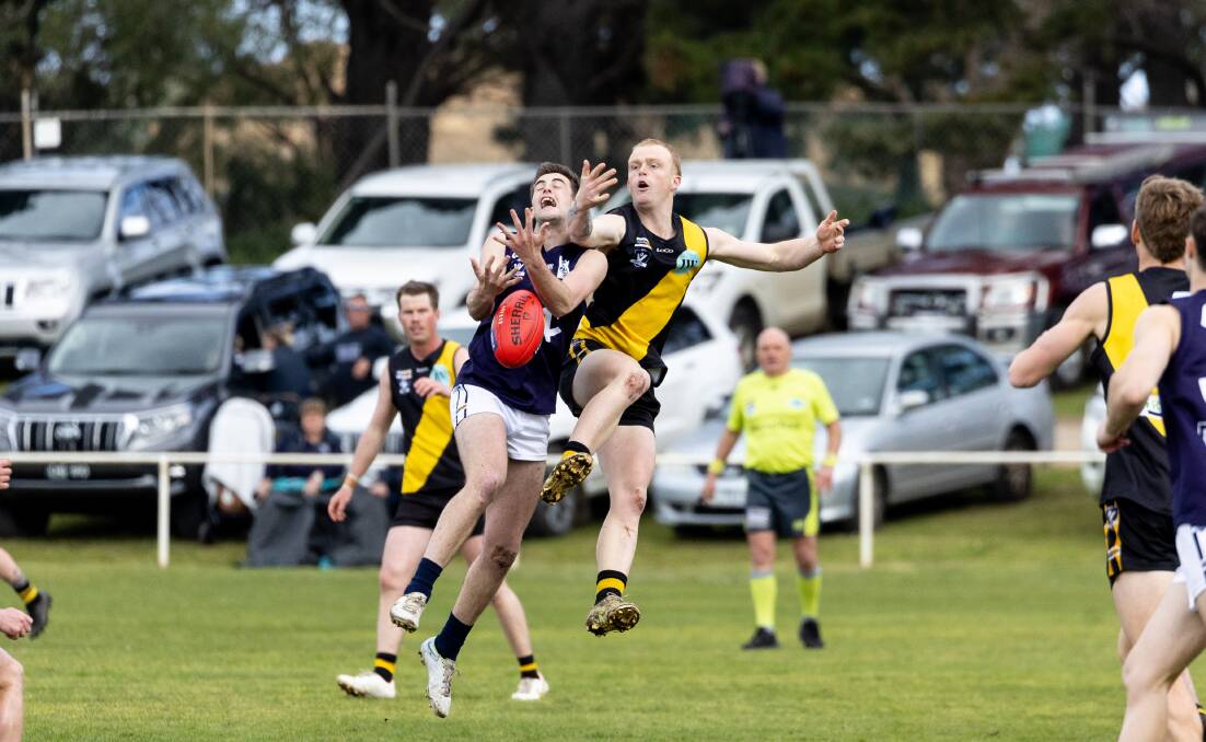 Nirranda's Dylan Philp and Merrivale's Tate Porter contest the footy.