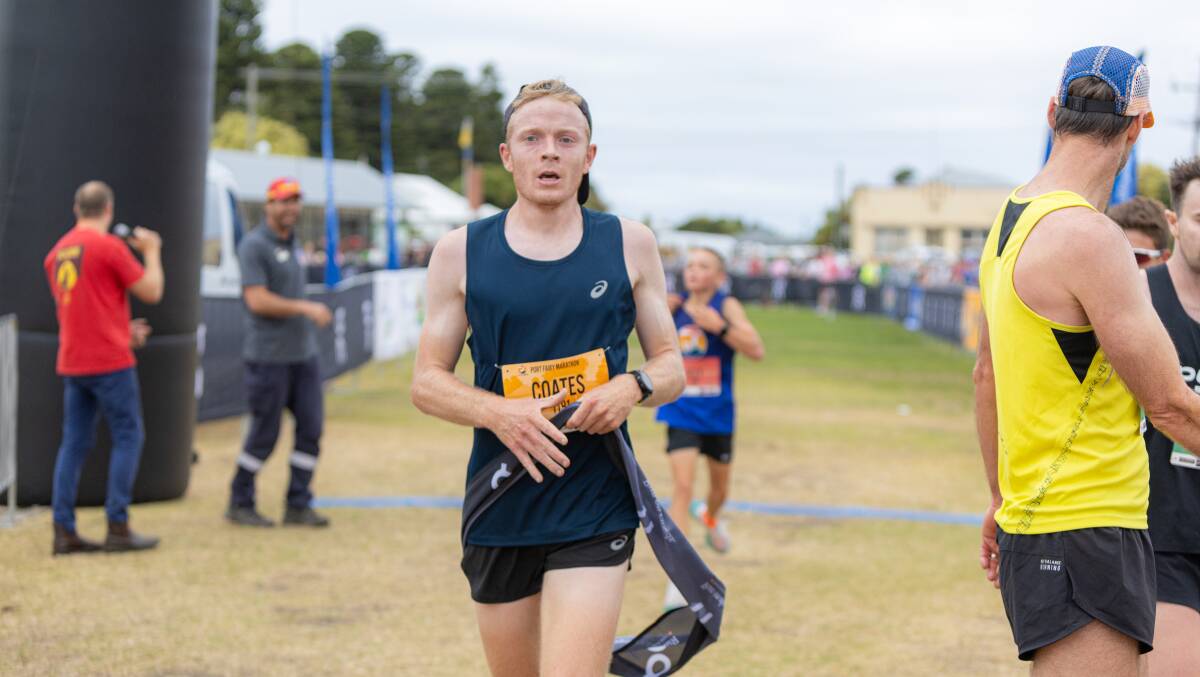 Jackson Coates soaks it all in after winning the 10km race at the Port Fairy Marathon. Pictures by Eddie Guerrero