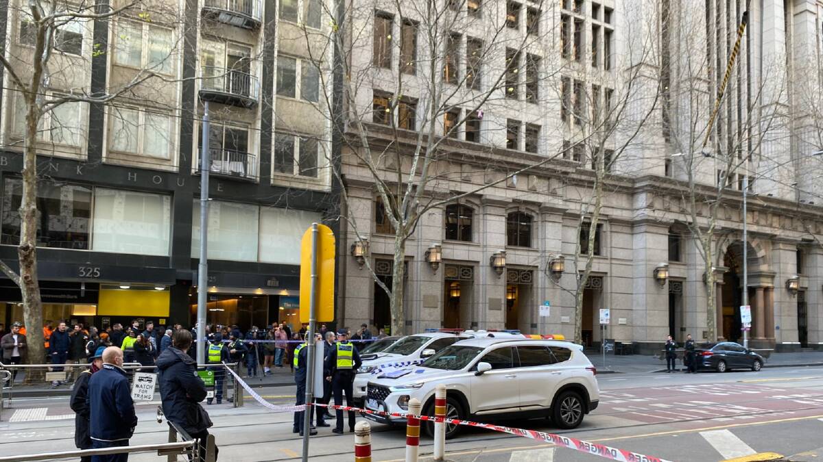 Police lock down Collins Street in Melbourne CBD on June 19 after an alleged hoax bomb threat. Picture Matt Smith/X