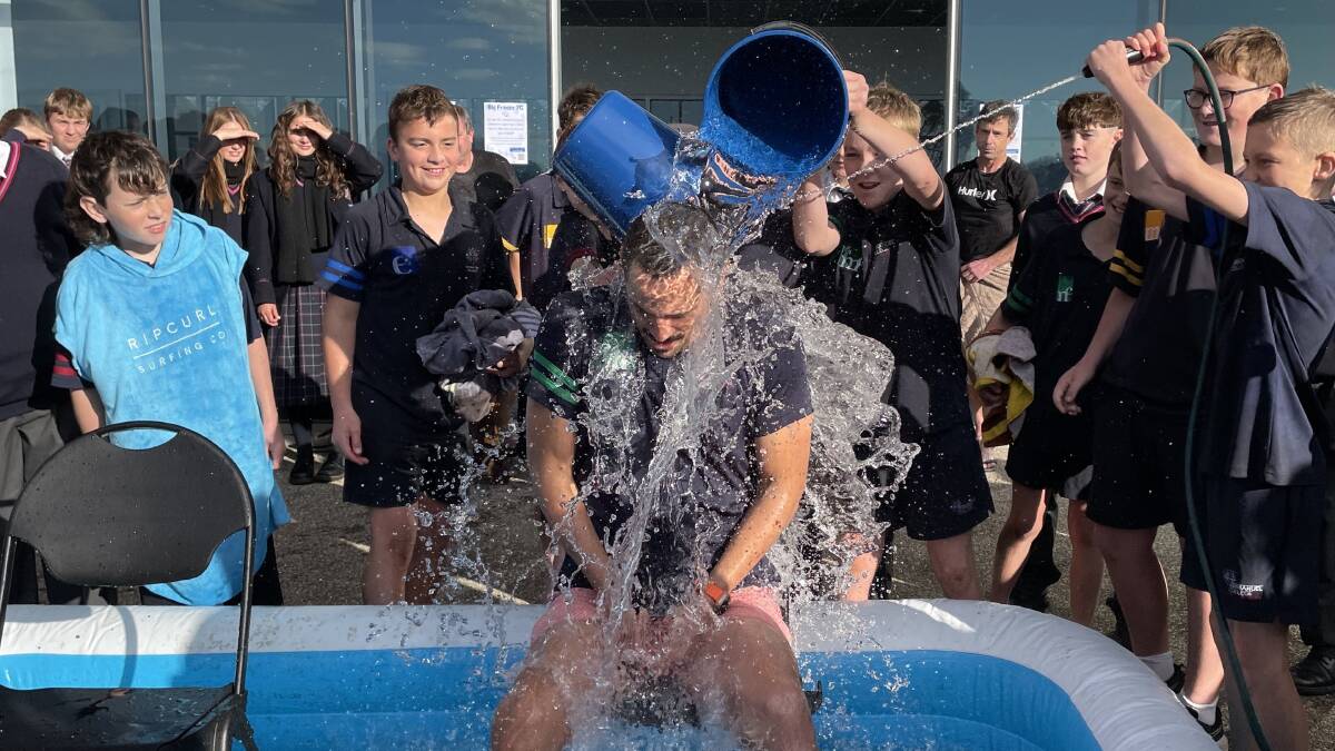 Students pour ice bucket over their teacher Mark Jansz. Picture by Sophia Baker